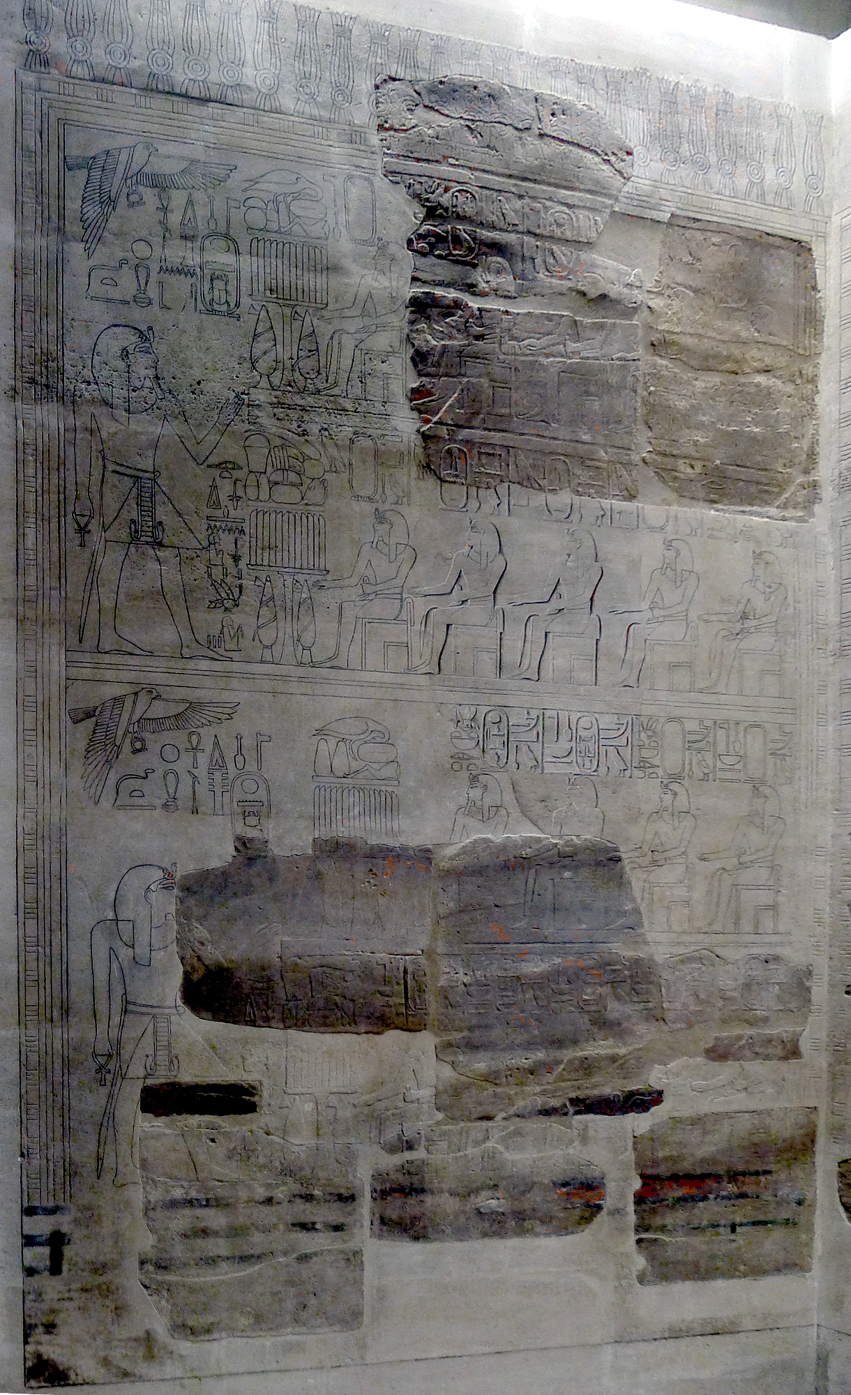Fragment of reliefs interspersed with recent drawing showing the likely continuation of the damaged parts