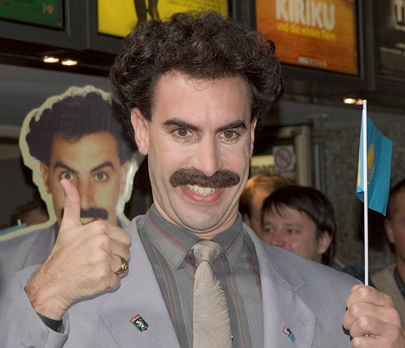 Baron Cohen giving a thumbs up, dressed as Borat