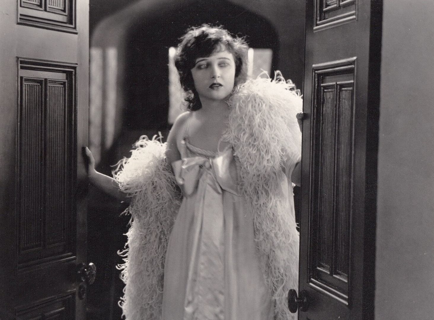 Woman walking through a door