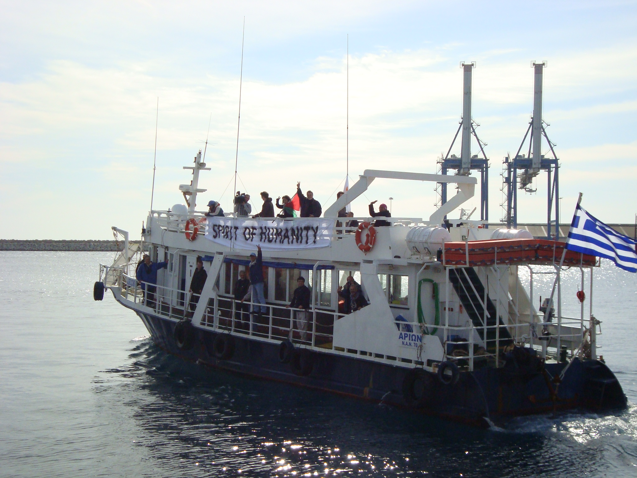 A vessel with a banner that reads 