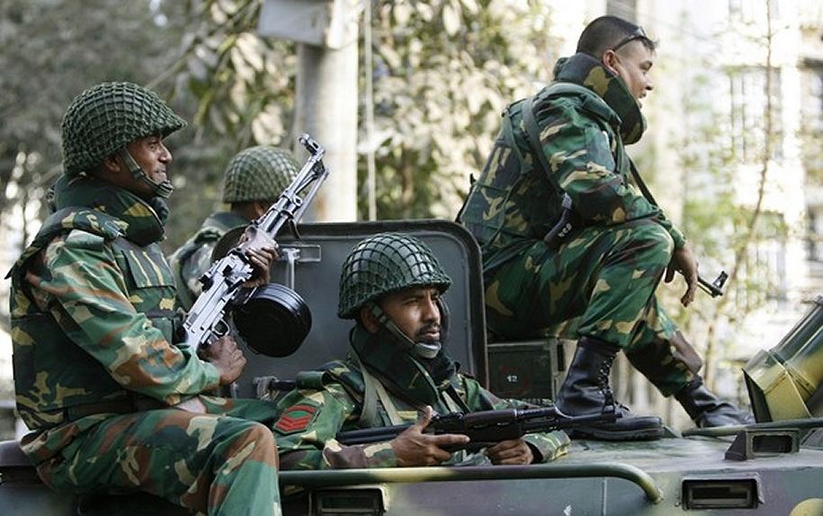 Bangladesh Army personnel on a BTR-80 armored personnel carrier.