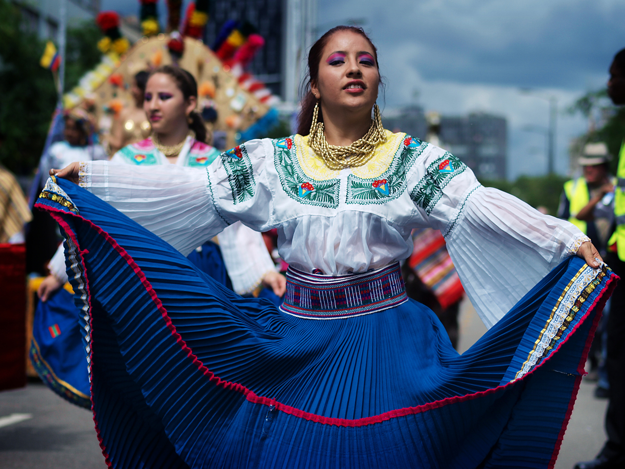 Mestizo women in traditional attire, showcasing Ecuador's vibrant cultural heritage.