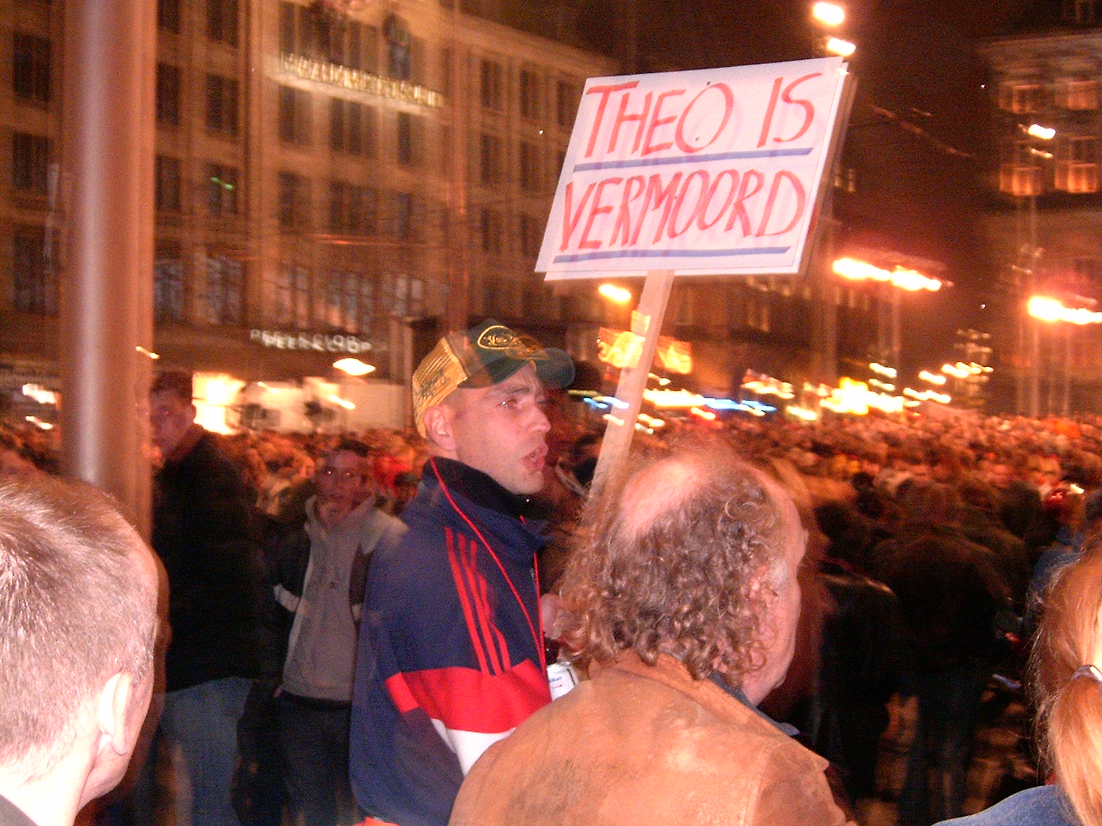 Demonstrators at the Dam Square after Van Gogh's murder. The sign reads