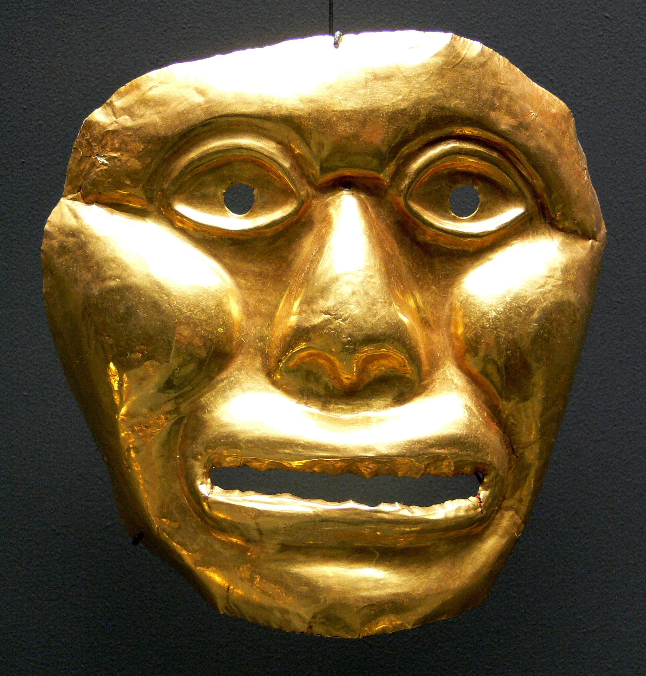 An Irama (Calima culture) funerary mask, representing Colombia's rich pre-Columbian artistic heritage, a foundational element of its diverse cultural identity.