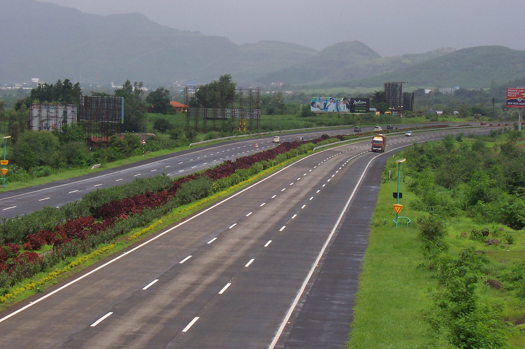 The Mumbai Pune Expressway, one of India's first six-lane high-speed concrete toll roads. Improved transport infrastructure is vital for economic growth but must be developed sustainably and equitably.