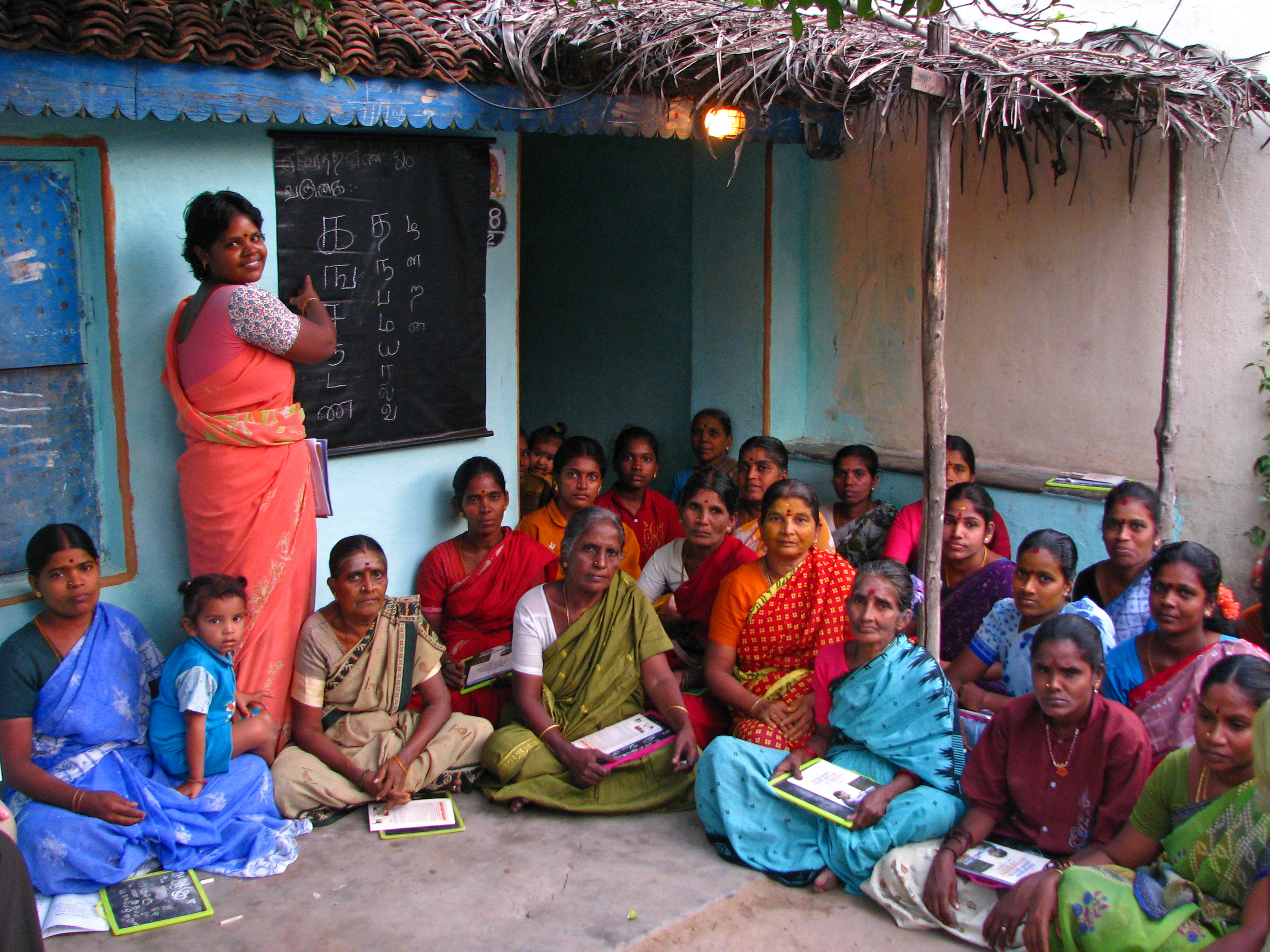 Women in sari at an adult literacy class in Tamil Nadu, showcasing the elegance and versatility of traditional Indian attire, which varies widely across regions.