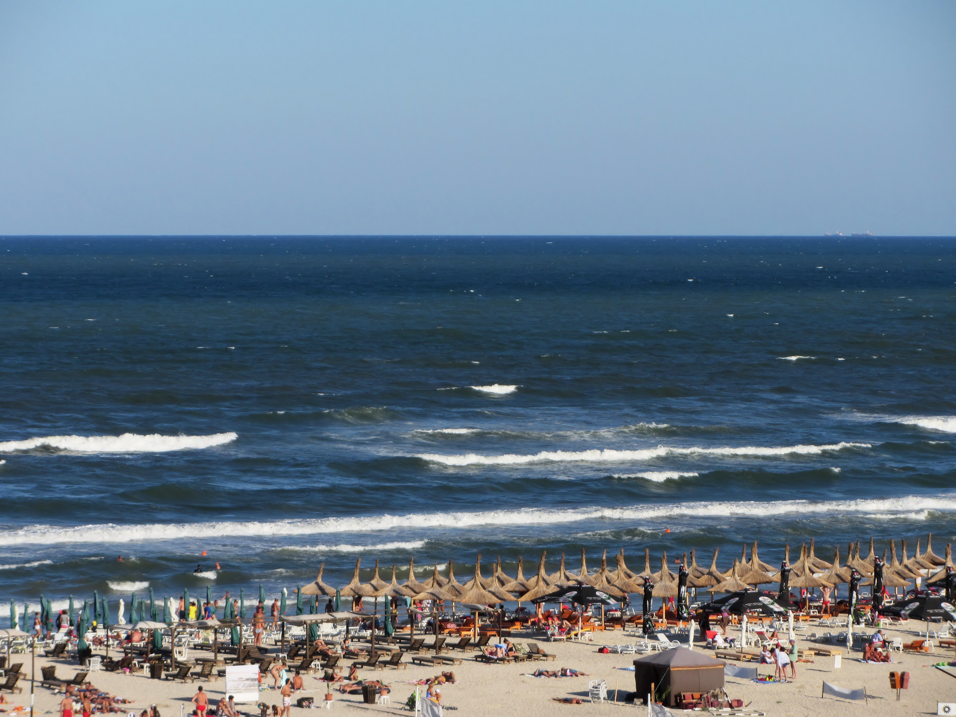 A beach in Mamaia, one of Romania's popular Black Sea resorts, known for its summer tourism.