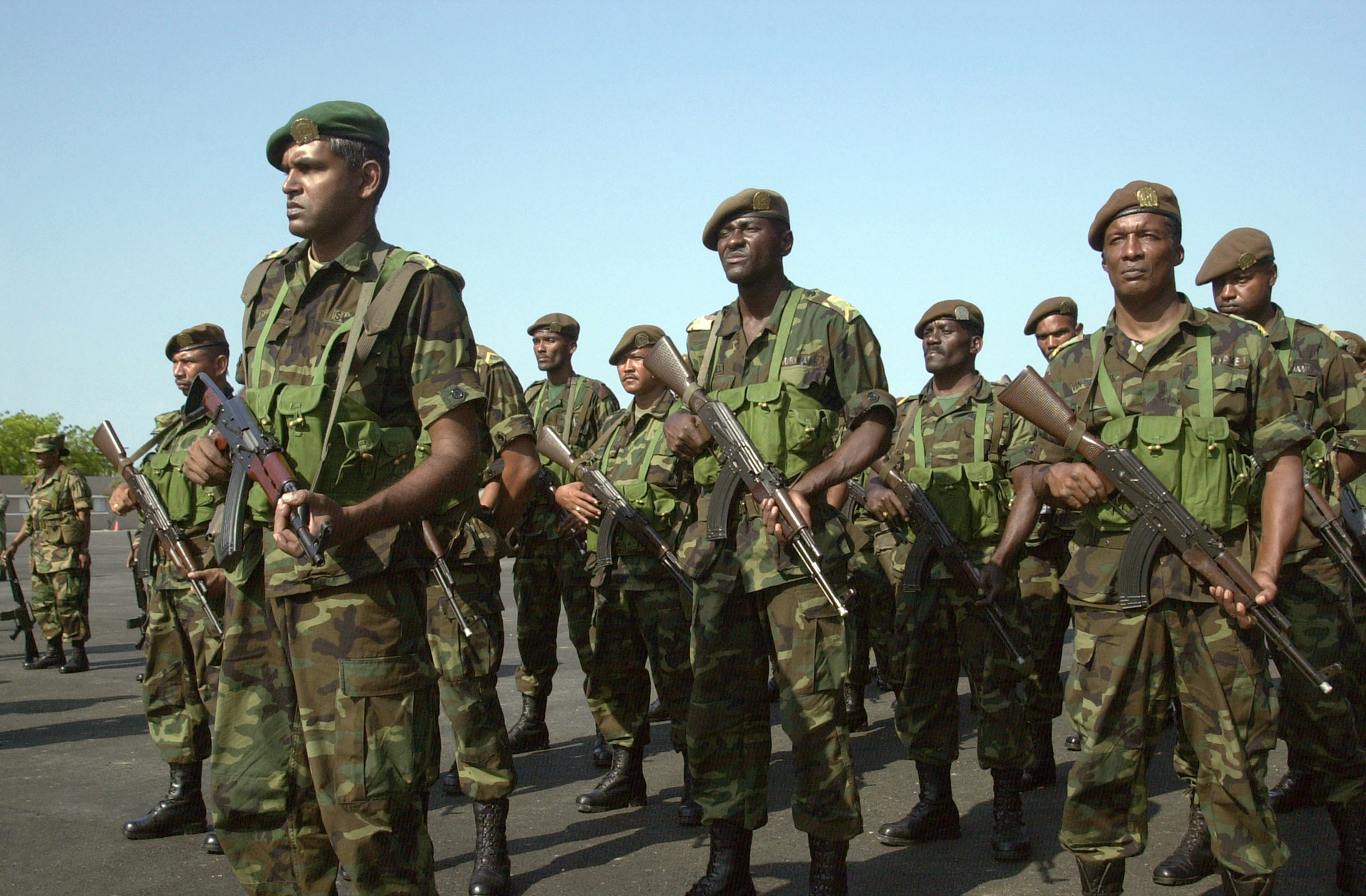 Surinamese soldiers in formation during a multinational exercise in 2004, indicating participation in regional security efforts.