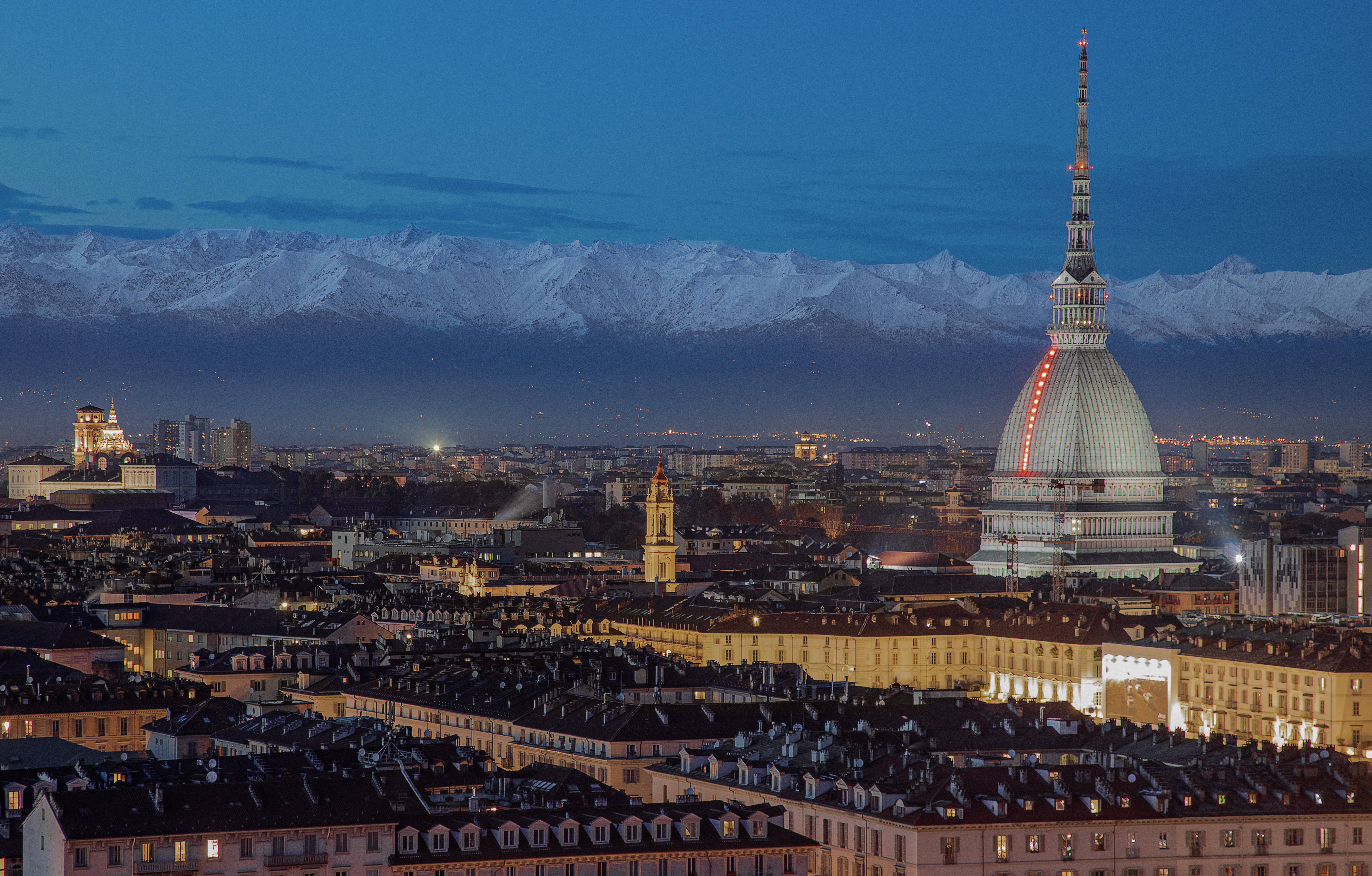 Panoramic view of Turin at dusk, with the Mole Antonelliana.