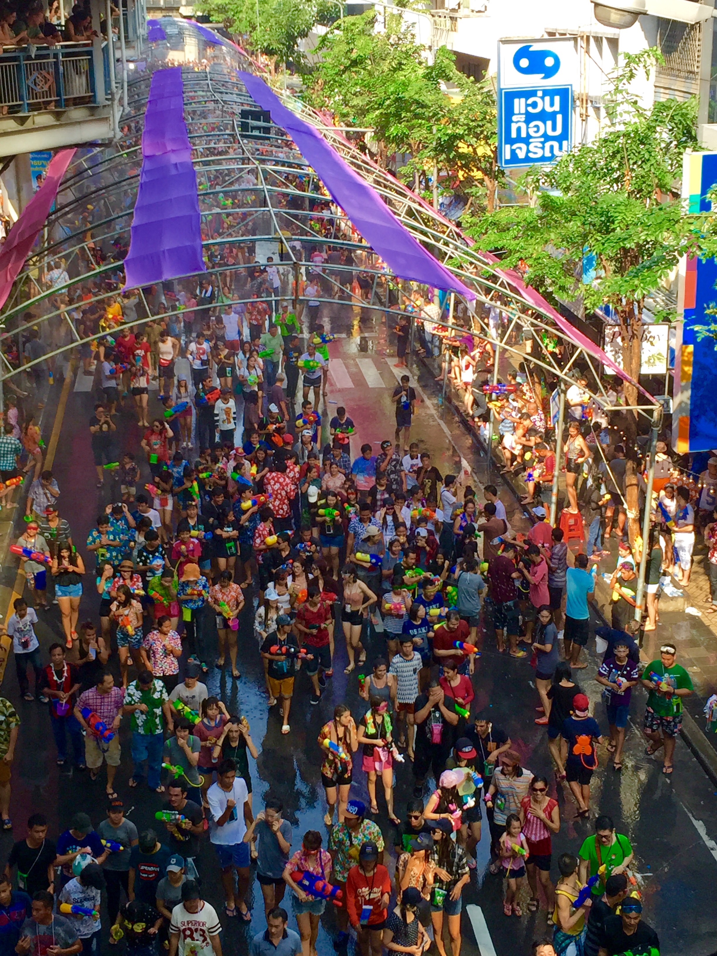 Revelers celebrating Songkran, the Thai New Year festival, by splashing water on Silom Road in Bangkok. Songkran is one of Thailand's most famous and widely celebrated festivals.