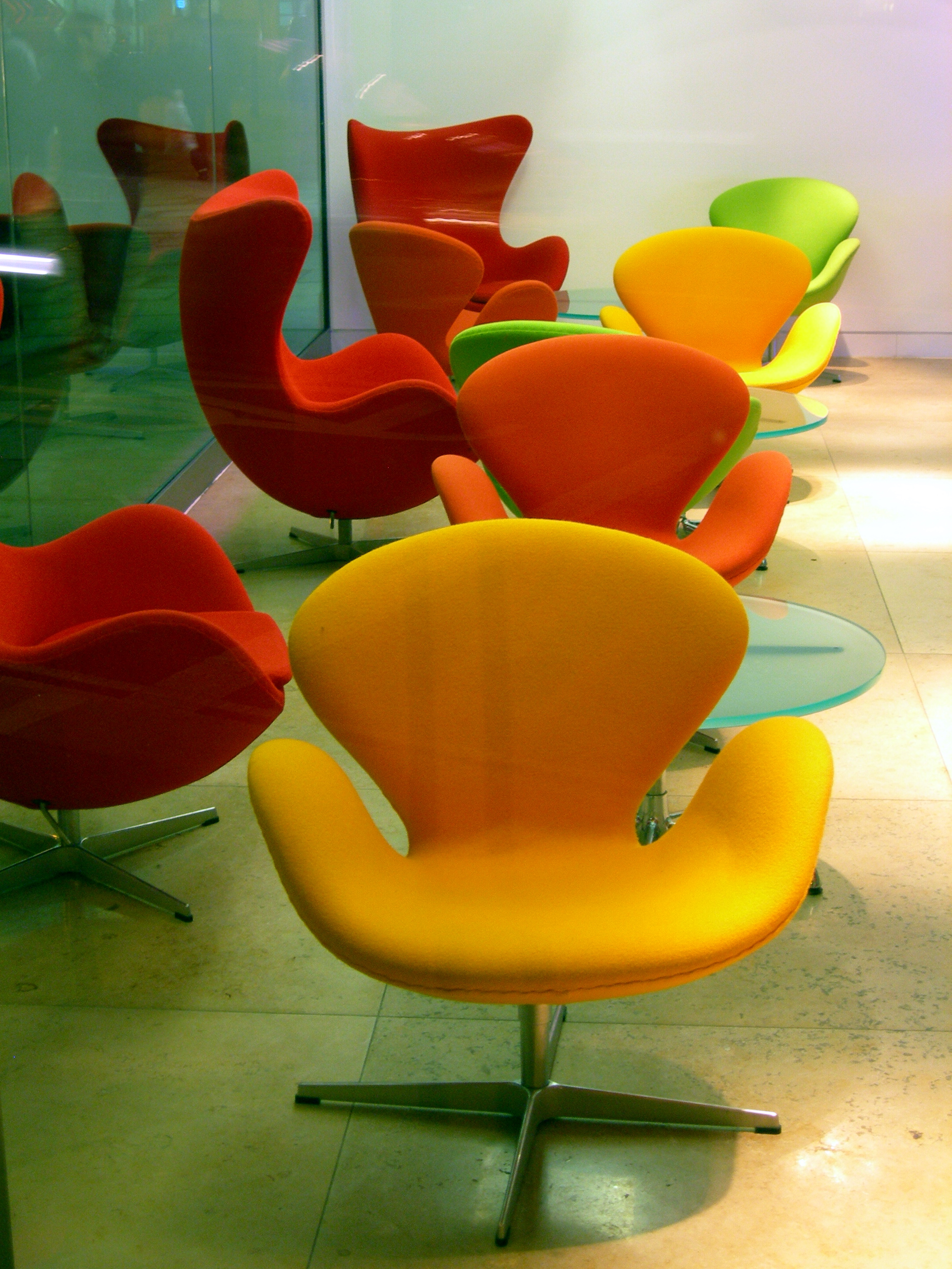 The Swan and Egg chairs, designed by Arne Jacobsen, iconic examples of Danish mid-century modern design.
