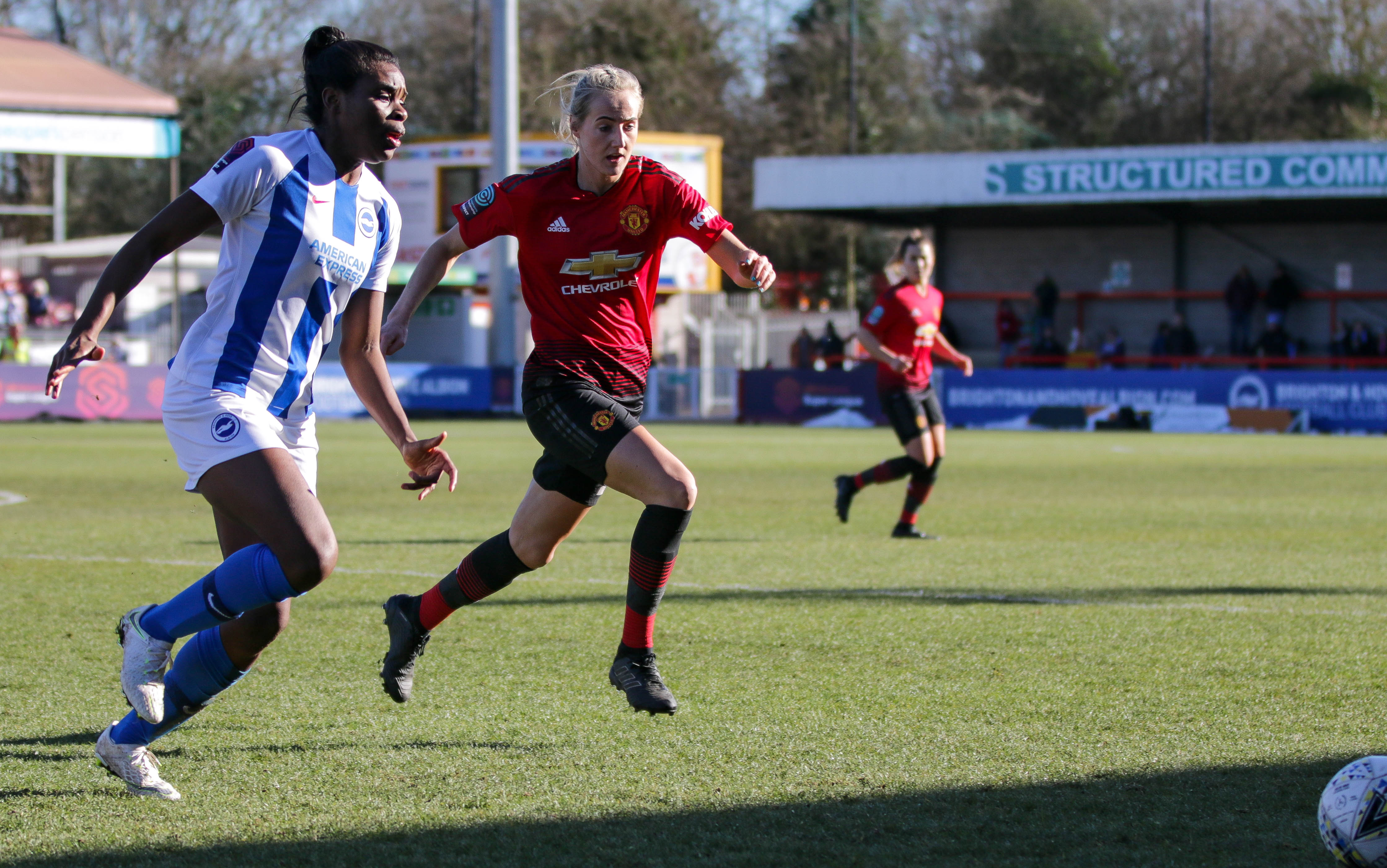Umotong (left) playing for Brighton & Hove Albion against Manchester United in February 2019.