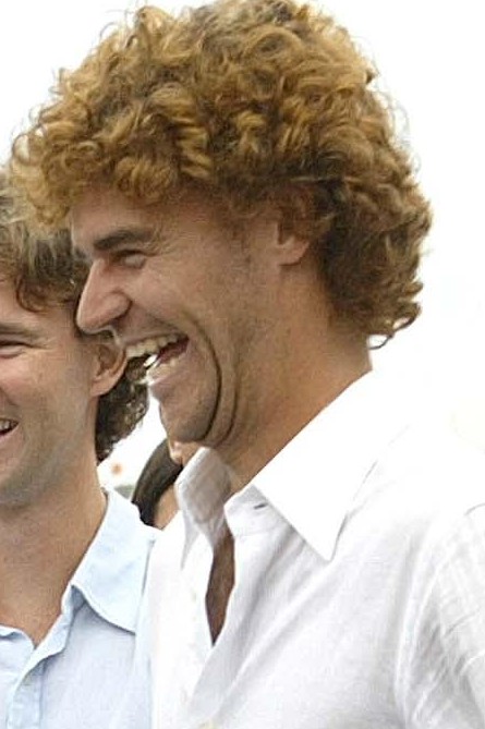 Gustavo Kuerten's aggressive baseline play and one-handed backhand were hallmarks of his style.