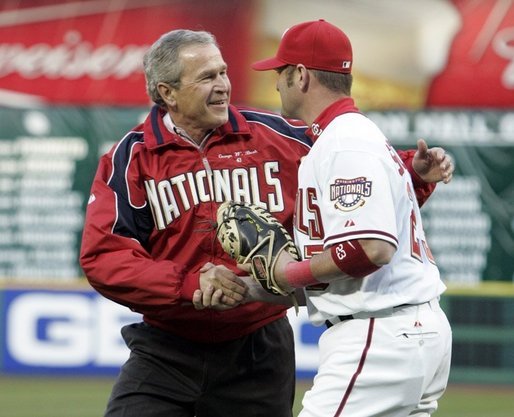 Schneider catching the first pitch from then-President George W. Bush at RFK Stadium at the Nationals' first home game on April 14, 2005.