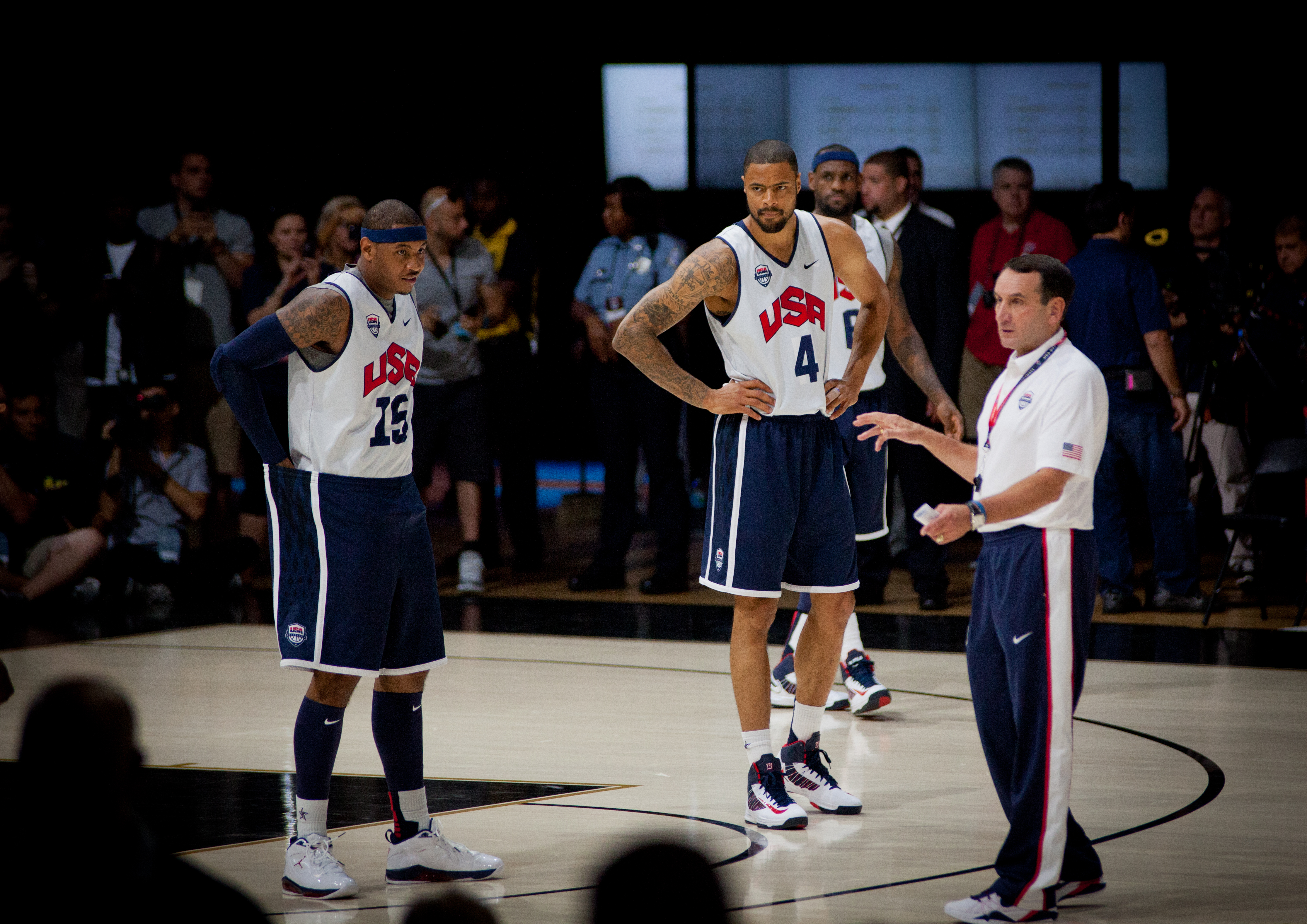 Carmelo Anthony, Tyson Chandler, and Krzyzewski during a national team practice ahead of the 2012 Olympics.