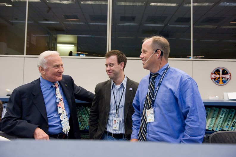 Aldrin in Mission Control with NASA spokesman Josh Byerly and Flight Director Ron Spencer in 2009.