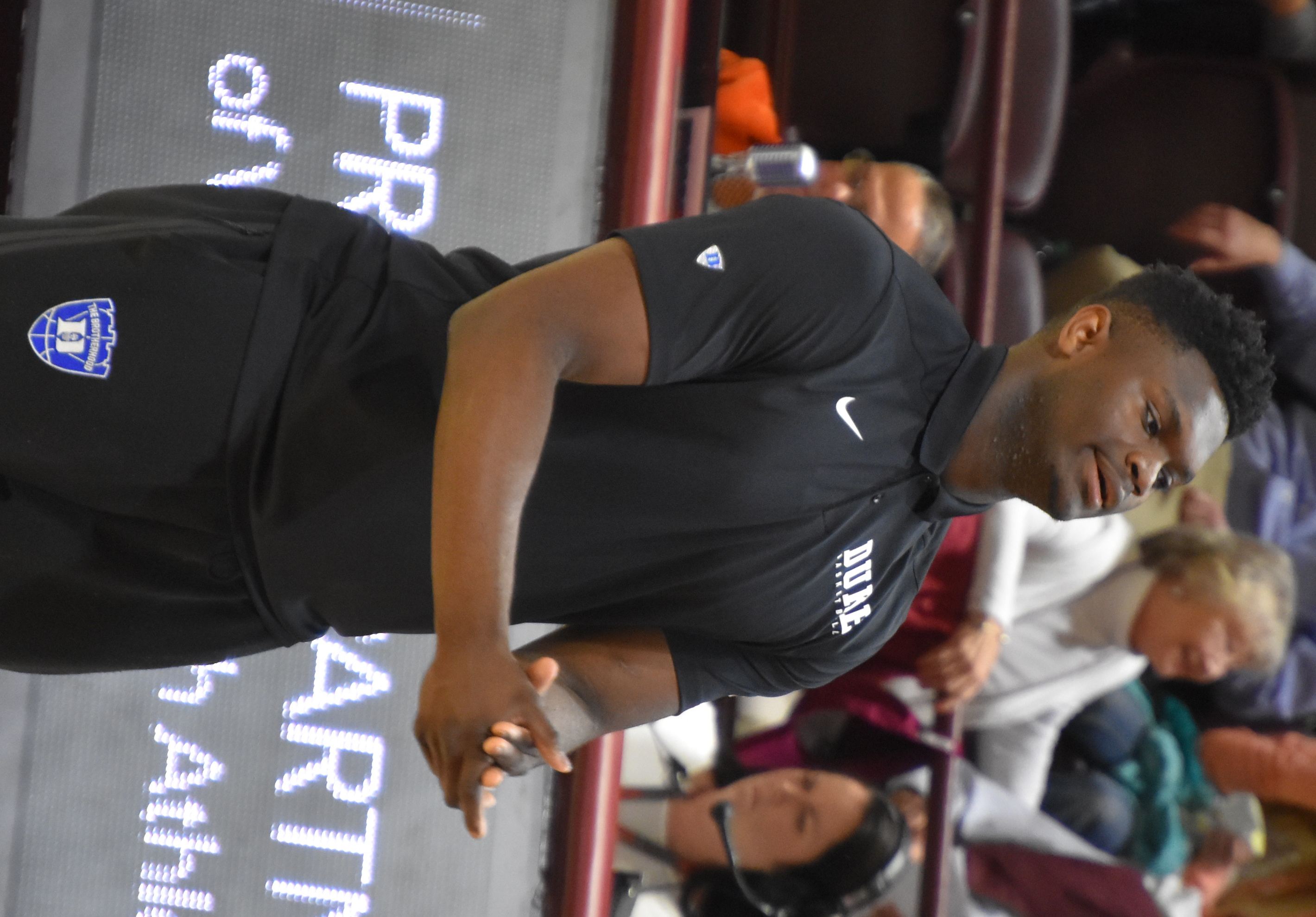Williamson walking on the court during a media timeout after his shoe broke.